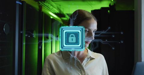 IT Specialist Monitoring Encrypted Server Security with Holographic Lock Interface