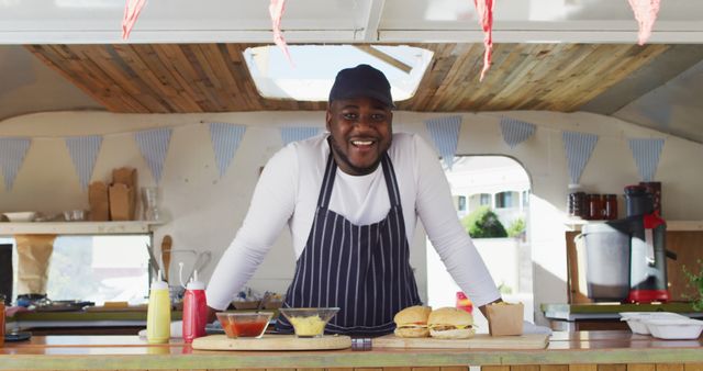 Smiling Chef with Burgers in Food Truck - Download Free Stock Images Pikwizard.com