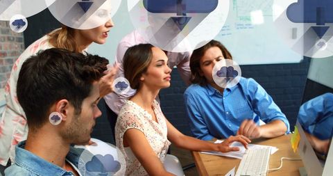 Diverse Team Collaborating on Cloud in Modern Office