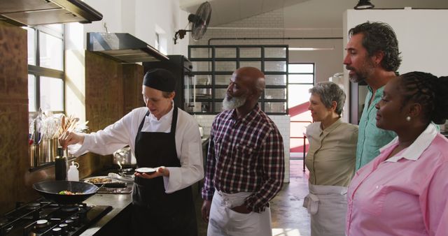 Group Participating in Cooking Class Led by Professional Chef - Download Free Stock Images Pikwizard.com