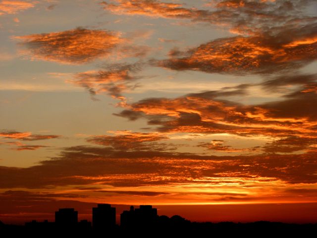 Dramatic Sunset Over Urban Skyline - Download Free Stock Photos Pikwizard.com