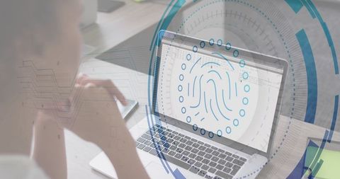 Mid-adult woman using laptop with fingerprint biometric overlay and tech interface
