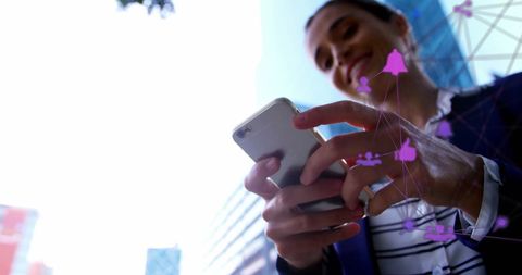 Biracial Businesswoman Engaging with Smartphone in Urban Setting - Download Free Stock Images Pikwizard.com