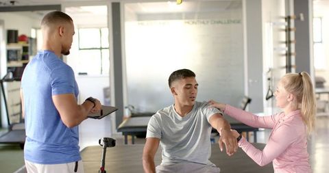 Physiotherapist Throughing for Arm Rehabilitation at Clinic