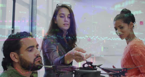 Diverse Team Collaborating with Digital Financial Interfaces