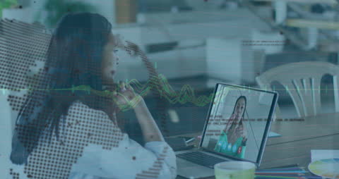 Businesswoman Engaging in Virtual Meeting with Data Overlay