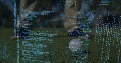 Soccer player kicking ball with digital code overlay