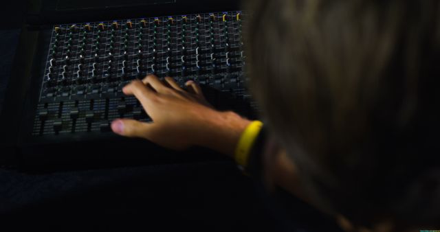 Person Operating Audio Mixing Console in Dark Environment - Download Free Stock Images Pikwizard.com