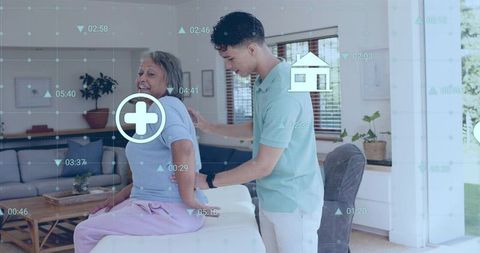 Caregiver assisting senior woman at home with mobility support and telehealth hud overlay