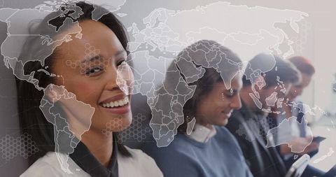 Diverse professionals using technology with global map overlay
