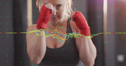 Determined Female Boxer Training with Waves of Energy