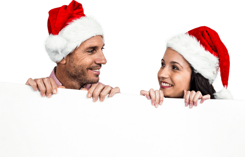 Smiling Couple in Santa Hats Holding Large Blank Sign Transparent - Download Free Stock Videos Pikwizard.com