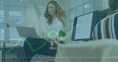 Working Businesswoman Typing on Laptop with Rising Analytics Overlay and Team Collaboration