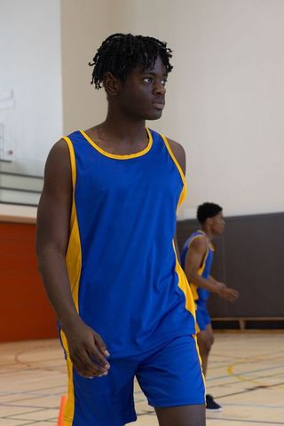 African American Male Basketball Players Training Indoors