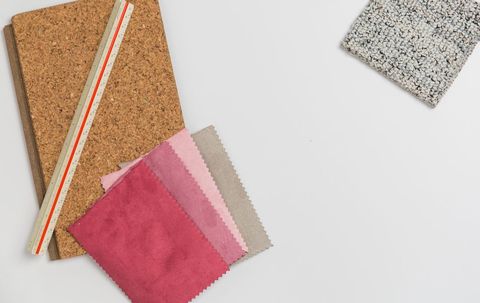 Colorful fabrics and design tools on white background