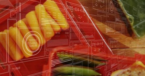 Placing yellow fruit wedges on wooden cutting board with augmented data overlay