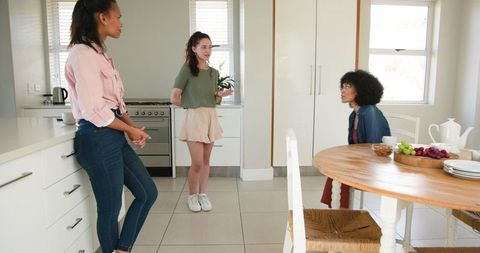 Happy Friends Enjoying a Casual Kitchen Gathering