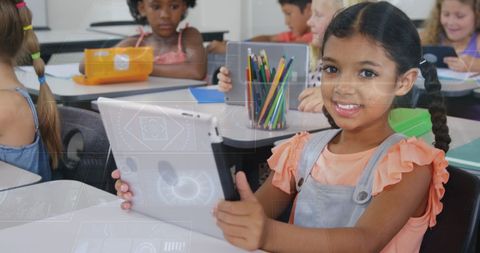 Diverse Students Learning with Digital Tablets in Classroom Setting