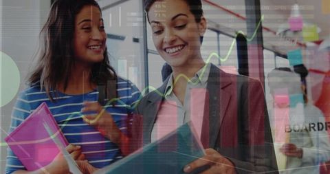 businesswomen analyzing data with futuristic overlay in office - Download Free Stock Images Pikwizard.com