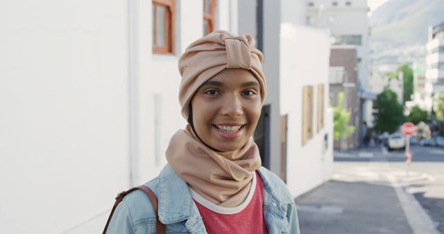 Young Woman in Urban Street, Smiling at Camera - Download Free Stock Images Pikwizard.com