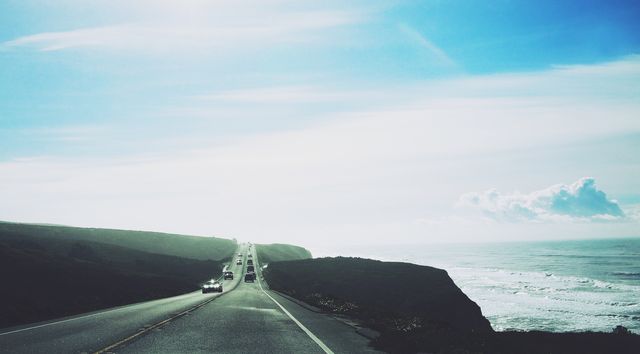 Scenic Coastal Highway with Ocean View on Sunny Day - Download Free Stock Photos Pikwizard.com
