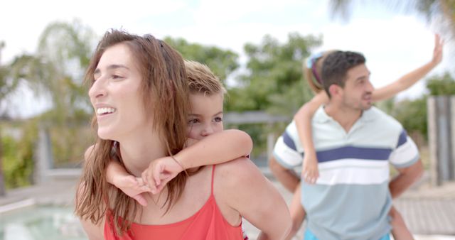 Happy Family Enjoying Outdoor Fun at Poolside - Download Free Stock Images Pikwizard.com