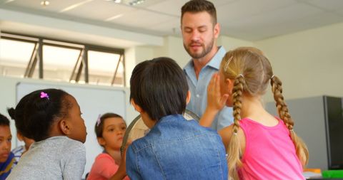 Engaged Children Learning Geography with Male Teacher - Download Free Stock Images Pikwizard.com