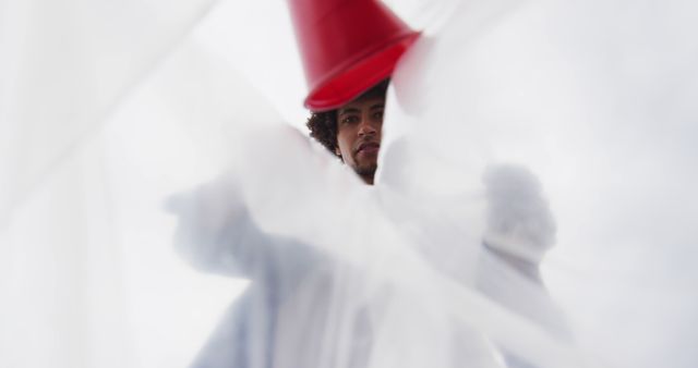 Low angle view of african american man putting garbage in a plastic bag - Download Free Stock Photos Pikwizard.com