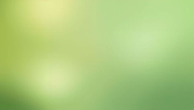 Soothing chartreuse to emerald gradient with soft light bokeh and calming abstract glow