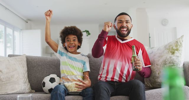 Father and Son Celebrating Soccer Game Victory at Home - Download Free Stock Images Pikwizard.com