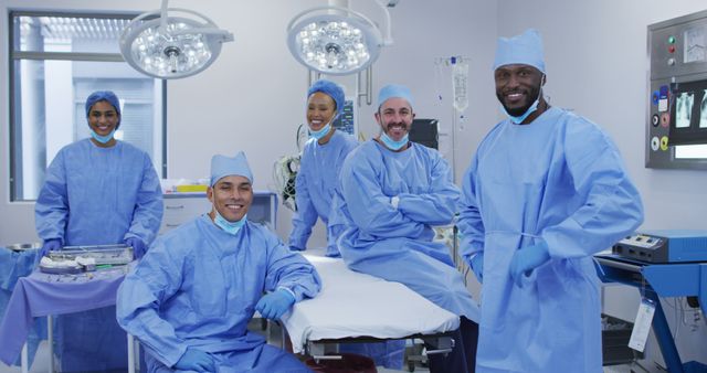 The image shows a team of medical professionals, including doctors and nurses, smiling confidently in an operating room. Ideal for promoting teamwork and collaboration in healthcare settings, it can be used for hospital brochures, health articles, and educational materials to emphasize the importance of multidisciplinary coordination in medical environments.