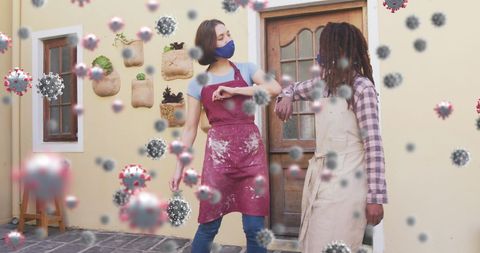 Women Greeting with Elbows in Pottery Studio Amid COVID-19