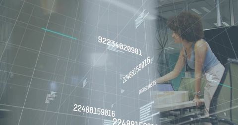 Businesswoman leaning over laptop with holographic data grid and futuristic interface