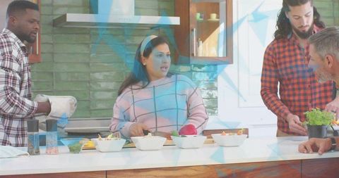 Friends Cooking Together on Sunlit Kitchen Island Chopping Vegetables and Preparing Meal