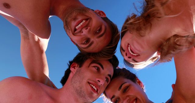 Group of friends huddled together outside - Download Free Stock Images Pikwizard.com