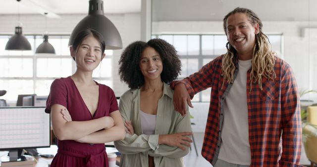 Diverse Young Professionals Smiling in Modern Office - Download Free Stock Images Pikwizard.com