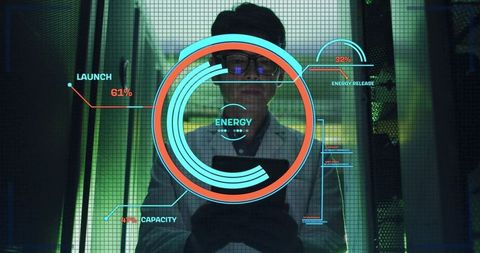 Korean it engineer monitoring energy hud in data center aisle holding tablet