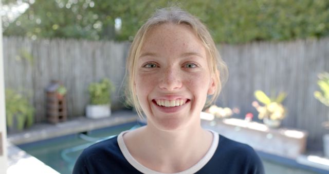 Smiling Teenage Girl Relaxing Outdoors near Pool - Download Free Stock Images Pikwizard.com