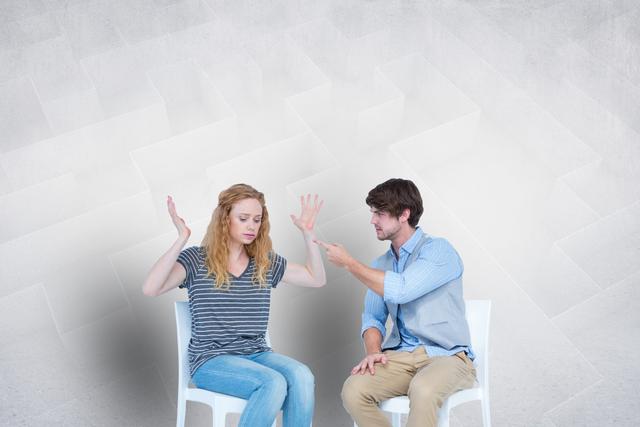 Digital composite of Couple arguing while sitting on chairs