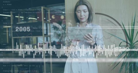 Businesswoman Analyzing Data on Tablet in Modern Office Lounge