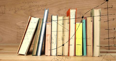 Row of Vintage Books Standing on Wooden Desk with Overlaid Math Graphs and Equations