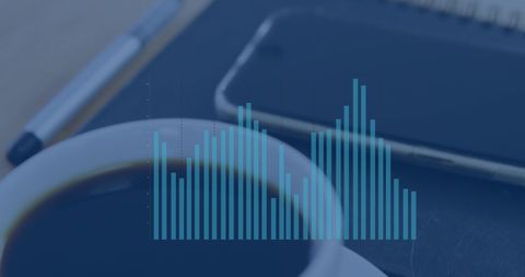 Graph Overlay with Coffee and Technology Tools on Work Desk