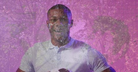 Confident Athlete Holding Soccer Ball with Global Digital Map Overlay