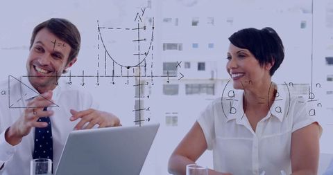 Business Professionals Analyzing Data with Mathematical Overlay