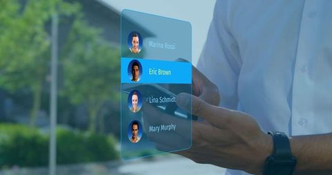 Executive tapping smartphone selecting holographic contact list in urban plaza