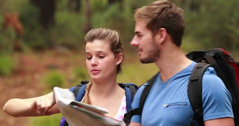Young Couple Navigating with Map During Nature Hike, Outdoor Adventure - Download Free Stock Images Pikwizard.com