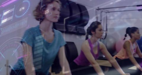 Three women performing reformer pilates class with futuristic hud fitness overlay