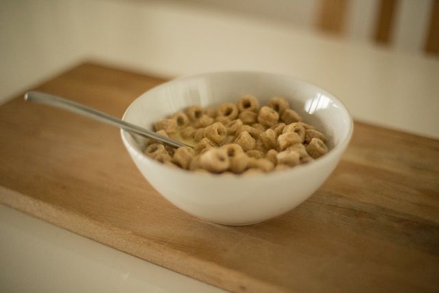 Bowl of Cereal with Spoon on Wooden Surface - Download Free Stock Photos Pikwizard.com