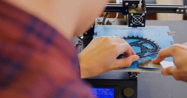 Close-Up of Person Operating 3D Printer - Download Free Stock Images Pikwizard.com