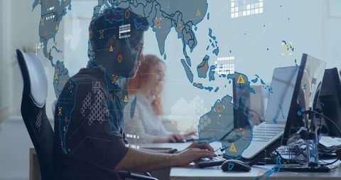 IT Analysts Monitoring Digital Alerts with Global Map Interface